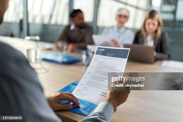 holding resume on job interview! - cv bildbanksfoton och bilder