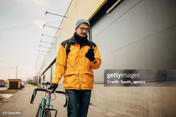 man using smart phone on the street - white glove phone stock pictures, royalty-free photos & images