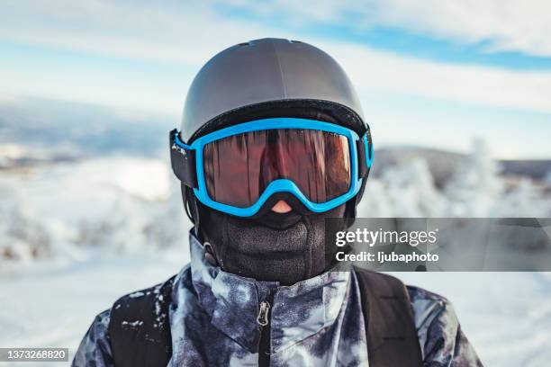 portrait of a man in a helmet with a ski mask. - luva roupa desportiva de proteção imagens e fotografias de stock