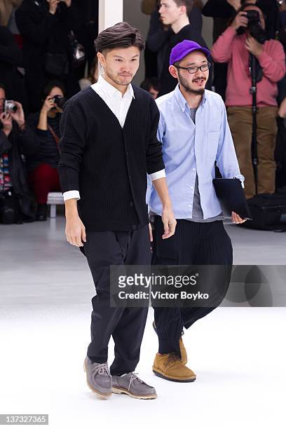 Designers walk the runway during the Issey Miyake Men Autumn/Winter 2013 show as part of Paris Fashion Week on January 19, 2012 in Paris, France.