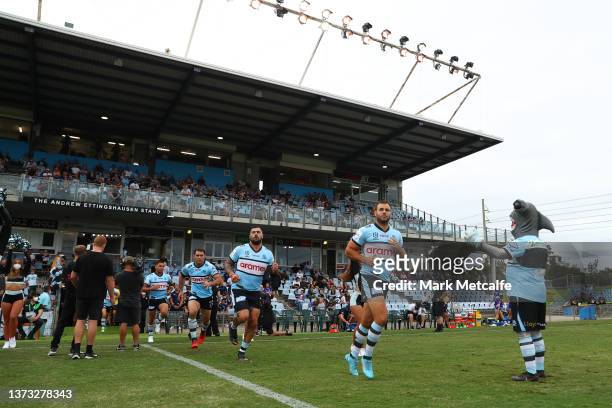 Wade Graham of the Sharks leads out the Sharks during the NRL Trial Match between the Cronulla Sharks and the Canterbury Bulldogs at PointsBet...