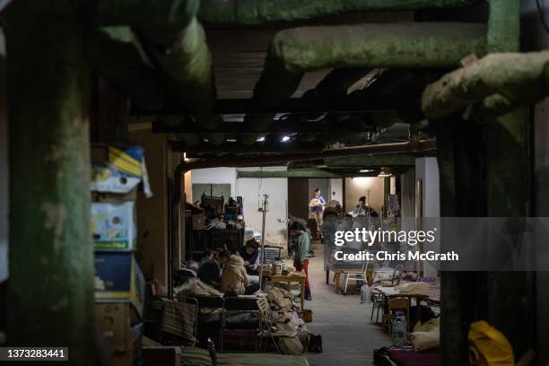 Mothers tend to their babies that are under medical treatment in the bomb shelter of the paediatric ward of Okhmatdyt Children's Hospital on February...