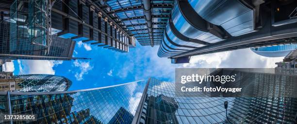 financial district skyscrapers soaring blue sky city of london panorama - financieel district stockfoto's en -beelden