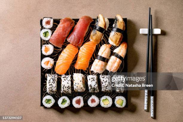 japanese dish sushi and rolls rice with fish - nigiri stock-fotos und bilder