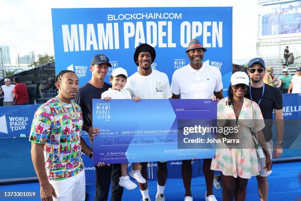 Ludacris, Wayne Boich, Jimmy Butler, and Alonzo Mourning pose with a check to Greater Miami Charities at Blockchain.com Miami Padel Open Finals...