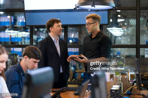 streamline business process and integrate blockchain in fintech (financial technology) solution. ceo talking and exchange ideas with a business development manager in a financial service business office. - financial technology stock pictures, royalty-free photos & images