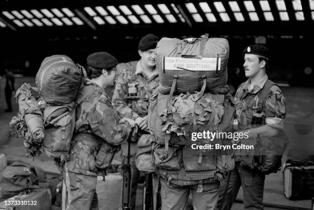 Soldier carries a message on his backpack,'The Falkland Islands are British' as he prepares to board the ocean liner the RMS Queen Elizabeth II for...