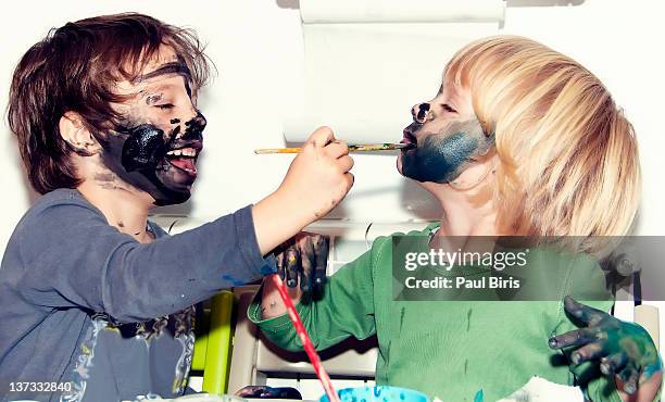 body painting face - kids misbehaving fotografías e imágenes de stock