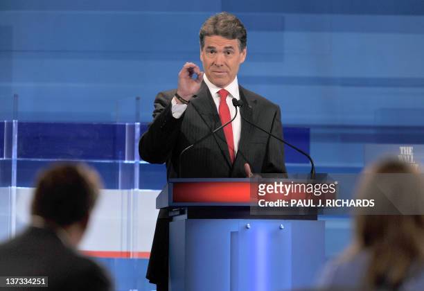 Republican presidential hopeful Rick Perry takes part in a South Carolina Republican presidential debate in Myrtle Beach, South Carolina, January 16,...