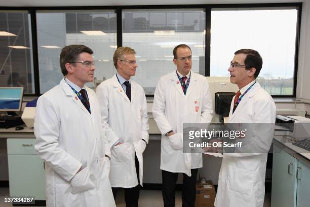 Olympics minister Hugh Robertson , Paul Deighton , London 2012 Chief Executive and Sir Andrew Witty , CEO of GSK, receive a tour by Professor David...