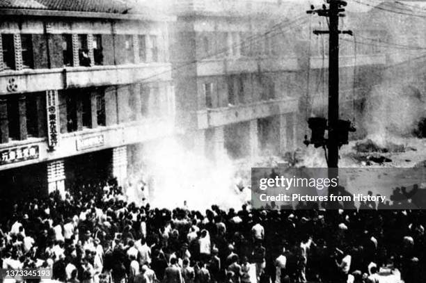 Crowd gathered outside the Taipei Branch of the Bureau of Monopoly on 28th February after a Taiwanese widow, suspected of selling contraband...