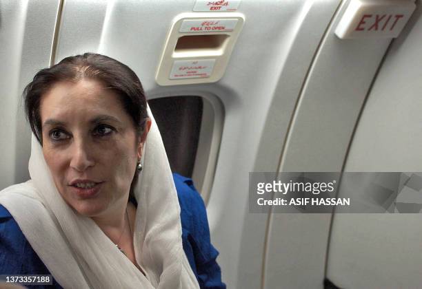 Pakistani former Prime Minister Benazir Bhuuto talks with media representatives in a plane flying towards Mohenjo Daro, 25 November 2007. The...