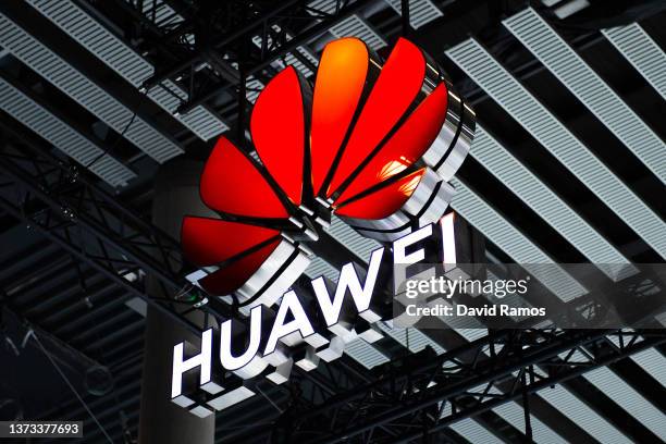 Logo sits illuminated outside the Huawei booth at the SK telecom booth on day 1 of the GSMA Mobile World Congress on February 28, 2022 in Barcelona,...