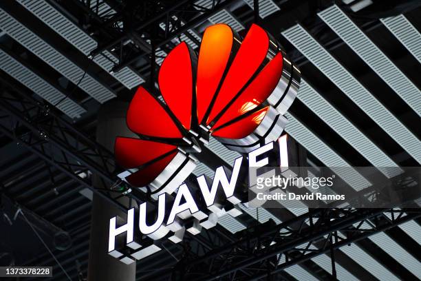 Logo sits illuminated outside the Huawei booth at the SK telecom booth on day 1 of the GSMA Mobile World Congress on February 28, 2022 in Barcelona,...