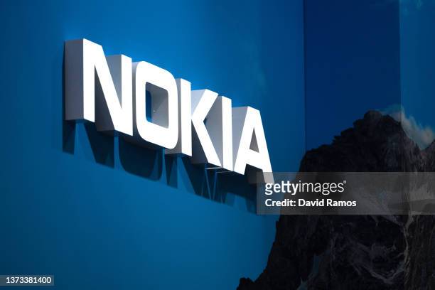 Logo sits illuminated outside the Nokia booth at the SK telecom booth on day 1 of the GSMA Mobile World Congress on February 28, 2022 in Barcelona,...