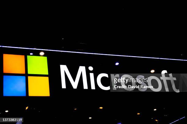 Logo sits illuminated outside the Microsoft booth at the SK telecom booth on day 1 of the GSMA Mobile World Congress on February 28, 2022 in...