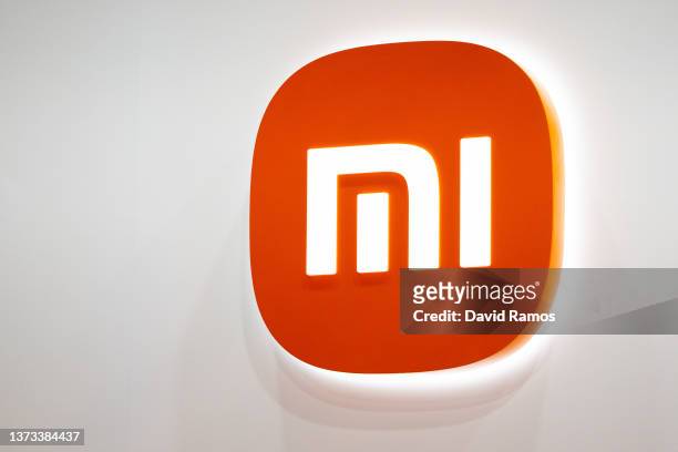 Logo sits illuminated outside the Xiaomi booth at the SK telecom booth on day 1 of the GSMA Mobile World Congress on February 28, 2022 in Barcelona,...