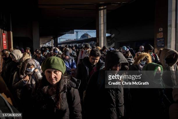 People crowd the Kyiv train station platform to catch trains to Poland or to places in the western parts of Ukraine on February 28, 2022 in Kyiv,...