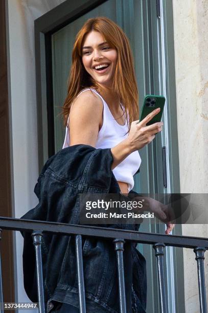 Model Kendall Jenner poses on a balcony on February 28, 2022 in Paris, France.