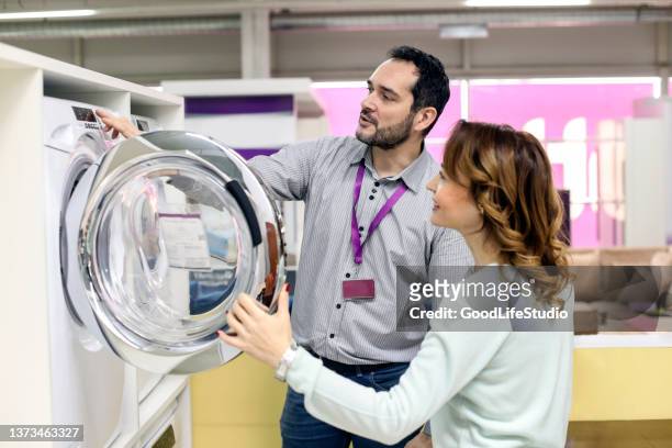 buying a new washing machine - buying washing machine stock pictures, royalty-free photos & images