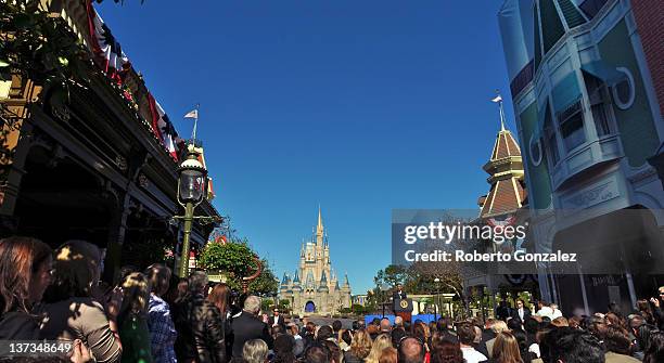 President Barack Obama speaks to a crowd of guests at Walt Disney World's Magic Kingdom with Cinderella Castle in the background January 19, 2012 in...