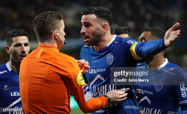 Adil Rami of Troyes argues with referee Francois Letexier during the Ligue 1 Uber Eats match between ESTAC Troyes and Olympique de Marseille at Stade...