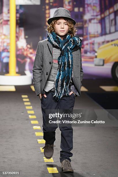 Young boy walks the runway of the Fun & Fun Girl fashion show as part of Pitti Immagine Bimbo 74 on January 19, 2012 in Florence, Italy.