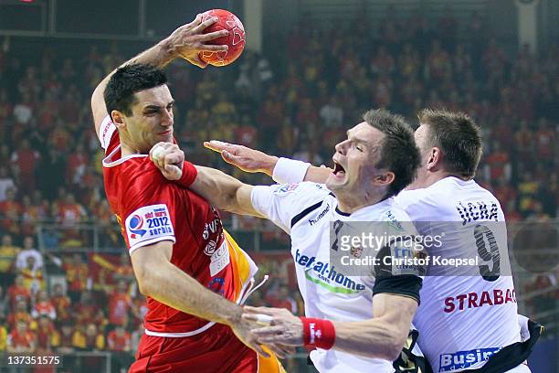 Karel Nocar of Czech Republic defends against Kiril Lazarov of Macedonia during the Men's European Handball Championship group B match between Czech...