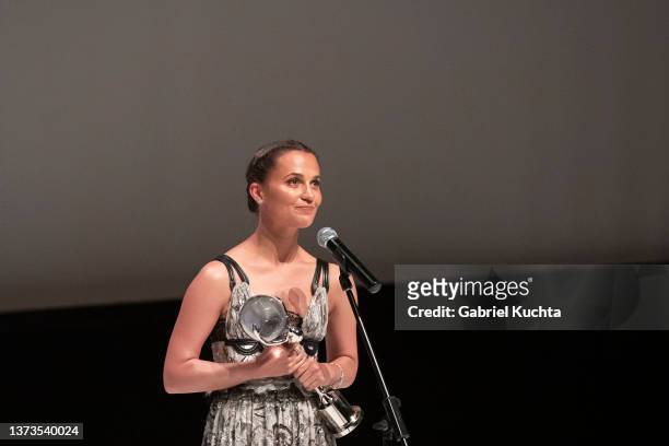 Alicia Vikander delivers a speech after receiving the Karlovy Vary IFF President's Award during the opening ceremony of the 57th Karlovy Vary...