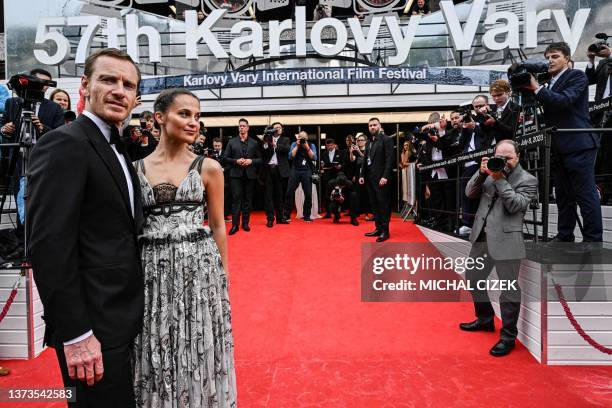 Swedish actress Alicia Vikander and her husband Irish actor Michael Fassbender pose on the red carpet of the 57th Karlovy Vary International Film...