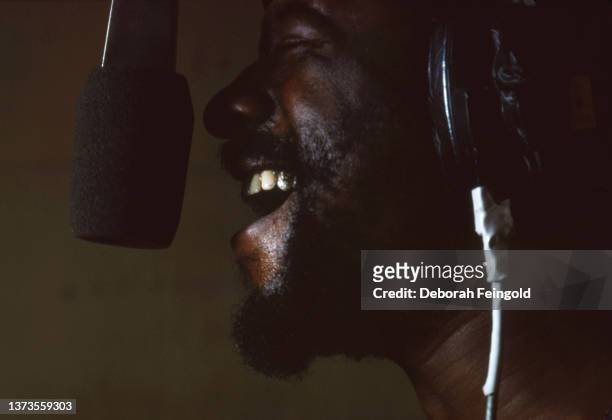 Deborah Feingold/Corbis via Getty Images) Close-up of American Jazz, Funk, & Blues musician James Blood Ulmer, eyes closed, as he signs into a...