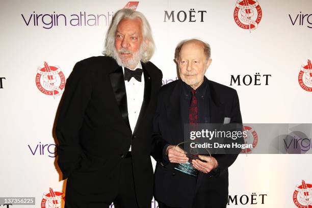 Donald Sutherland poses with Nicolas Roeg after presenting him with his Excellence In Film Award in the press room at the London Film Critics' Circle...