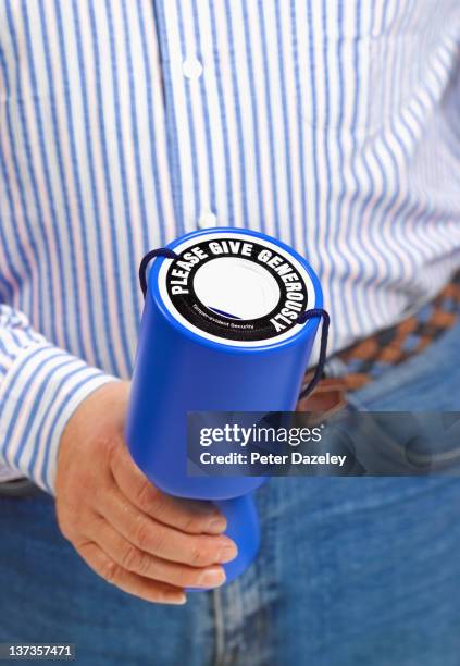 charity donation box - man holding donation box stock pictures, royalty-free photos & images