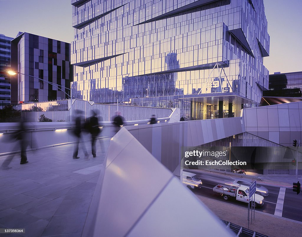 Commuters arriving at a futuristic office district