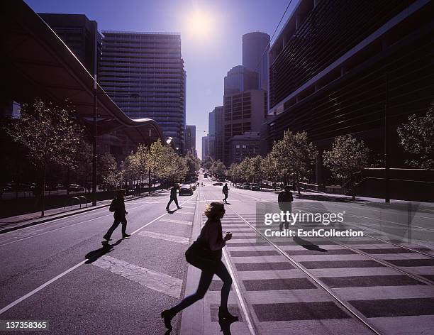 morning commuters crossing the street in melbourne - crossing road stock pictures, royalty-free photos & images