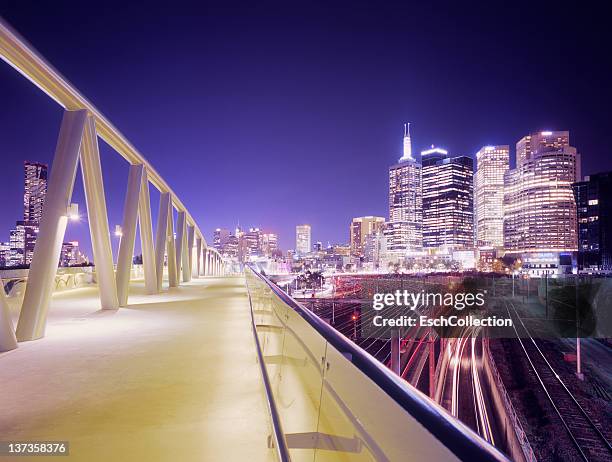 walkway and train tracks with skyline of melbourne - melbourne skyline stock pictures, royalty-free photos & images