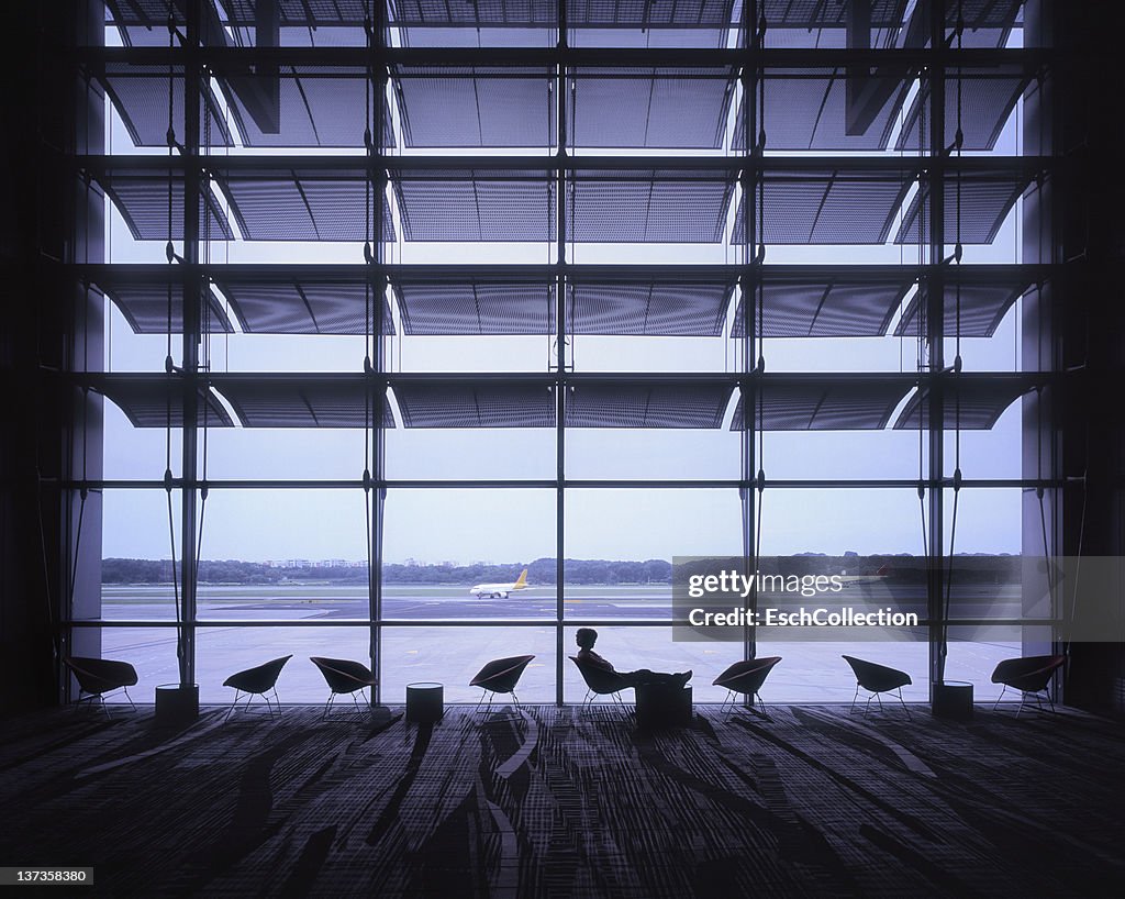 View on runway with planes arriving at airport