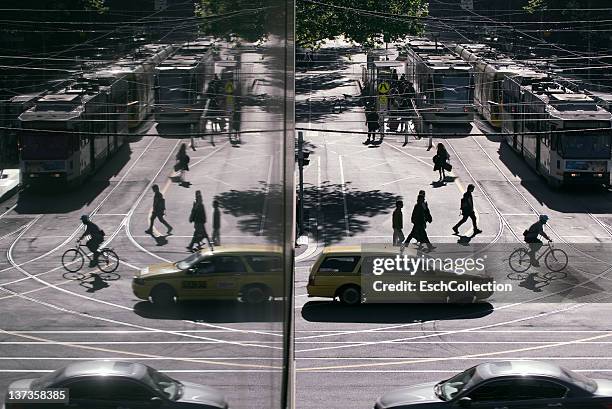 busy morning commute with people, trams and taxi - australia taxi stock pictures, royalty-free photos & images