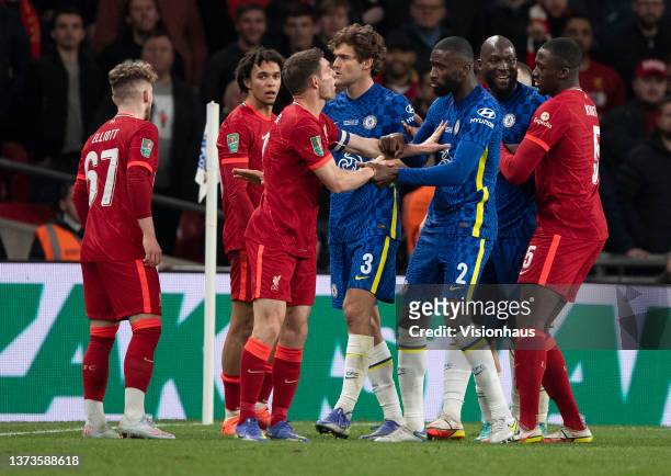 James Milner of Liverpool and Antonio Rudiger of Chelsea square up to each other during the Carabao Cup Final match between Chelsea and Liverpool at...