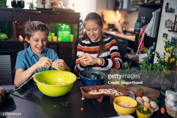 children making various easter cakes - dirty easter stock pictures, royalty-free photos & images