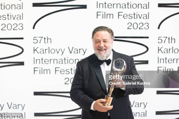 Russell Crowe poses for a photo after he received the Crystal Globe during the opening ceremony of the 57th Karlovy Vary International Film Festival...