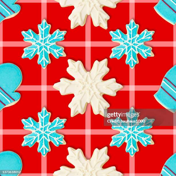 mitten, blue and white snowflakes: christmas cookie repeating pattern background wallpaper - sugar cookie background stock illustrations