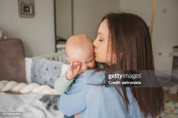 mother and baby at home - moms crying in bed stock pictures, royalty-free photos & images