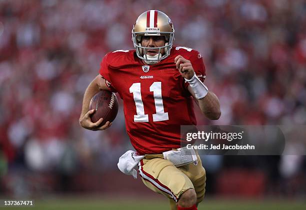 Alex Smith of the San Francisco 49ers runs in for a touchdown in the fourth quarter against the New Orleans Saints during the NFC Divisional playoff...