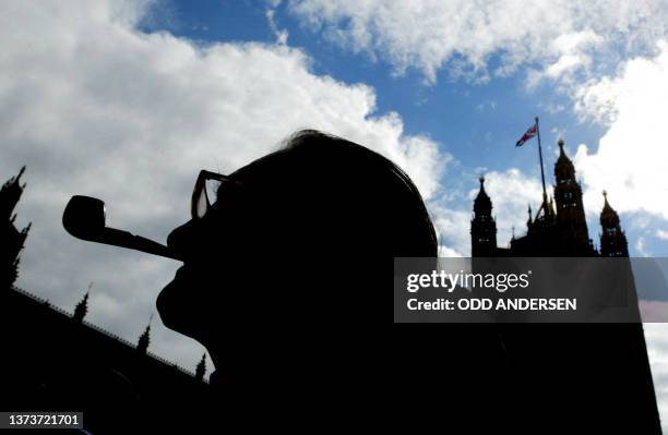 British pensioner protests in front of the Houses of Parliament about the small increase in their pensions 10 September, 2003 in London. The...