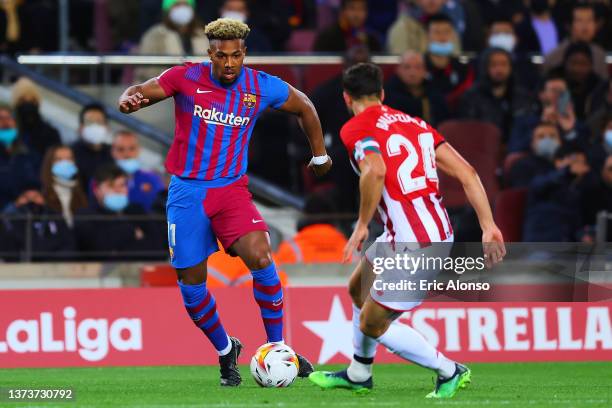 Adama Traore of FC Barcelona dribbles Mikel Balenziaga of Athletic Club during the LaLiga Santander match between FC Barcelona and Athletic Club at...