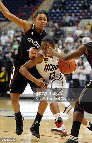 Connecticut's Brianna Banks drives to the basket around Cincinnati's Alyesha Lovett in the second half at Gampel Pavilion in Storrs, Connecticut, on...