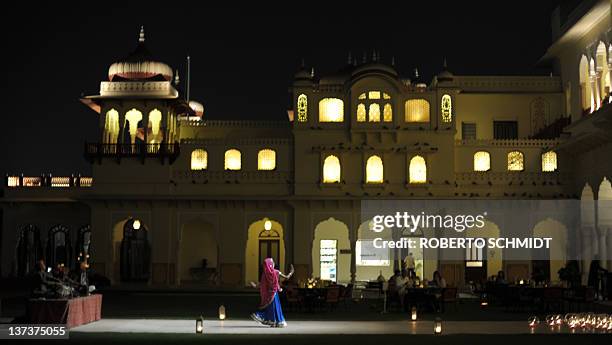 India-heritage-tourism-conservation-business, FEATURE BY RUPAM JAIN NAIR An Indian dancer performs at the Rambagh Hotel heritage palace in Jaipur on...