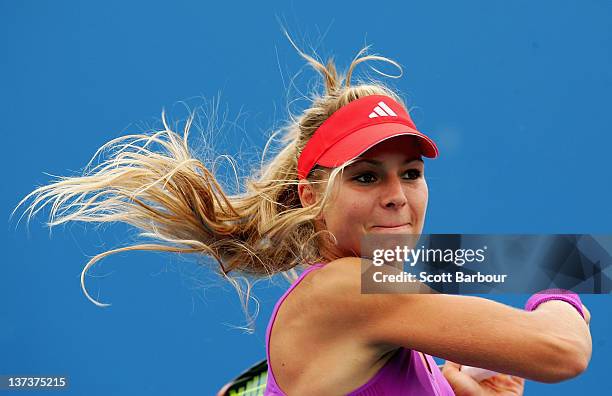 Maria Kirilenko of Russia plays a forehand in her second round doubles match with Nadia Petrova of Russia against Klaudia Jans-Ignacik and Urszula...