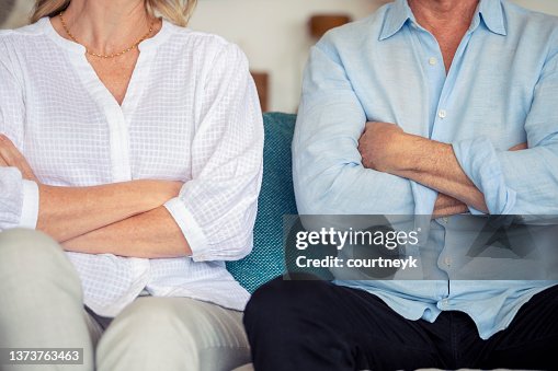 Mature couple fighting at home sitting on the sofa. Mature couple fighting at home sitting on the sofa.
